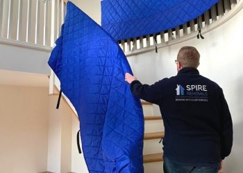 A member of the Spire Removals team at the stairs during a house move.